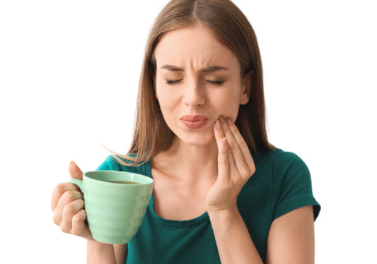 How do night guards prevent teeth sensitivity?