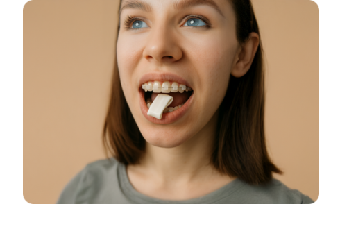 A woman chewing gum with ceramic braces
