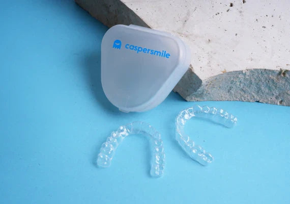 Caspersmile Night Guard placed on a clear surface.