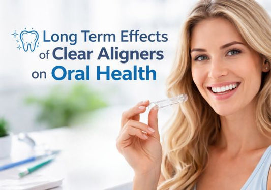 A girl smiling while holding clear aligners