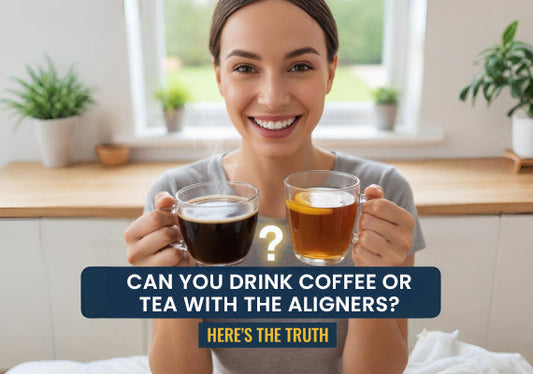 A woman holding coffee and tea.